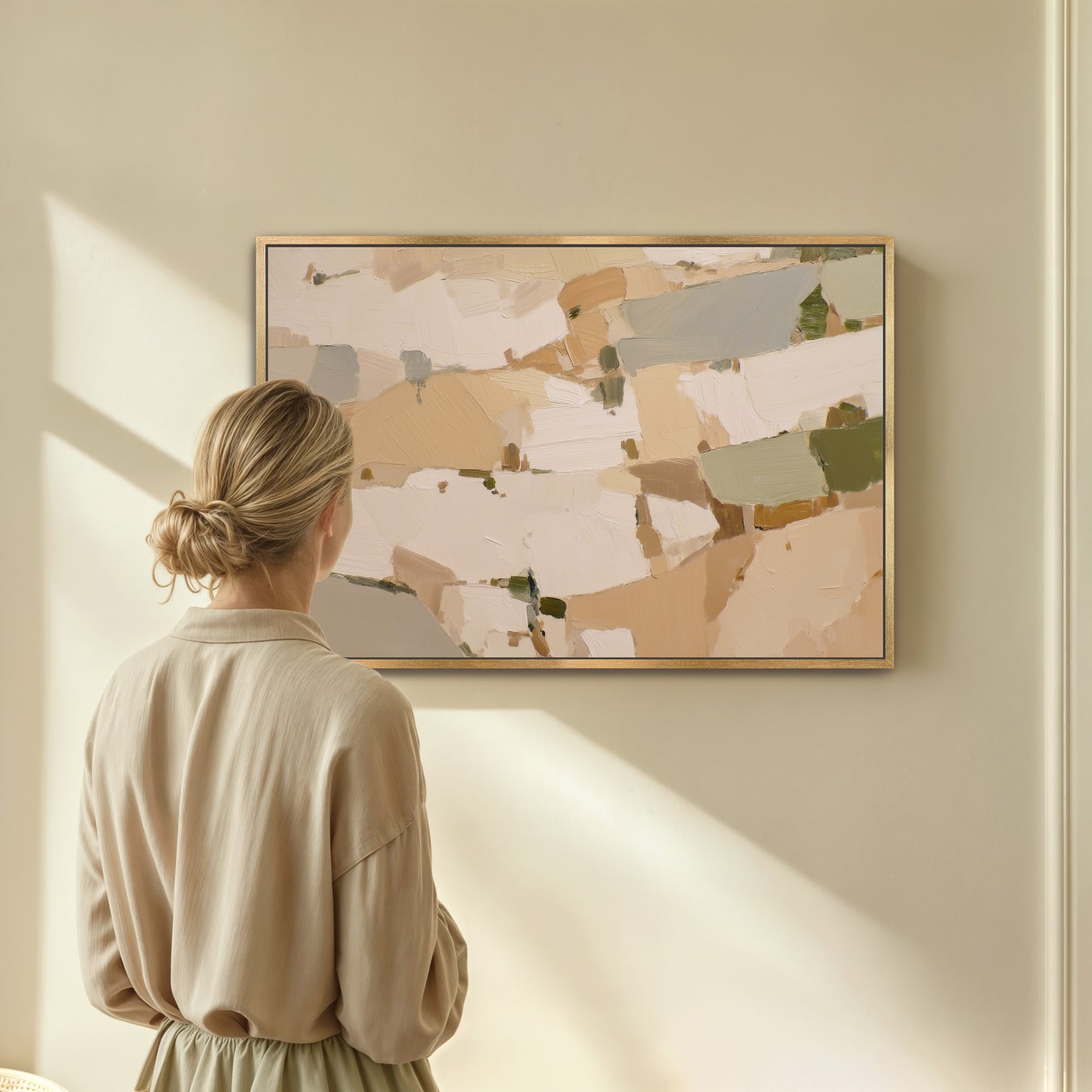 A woman stands in front of a large abstract painting, gazing at it with interest.