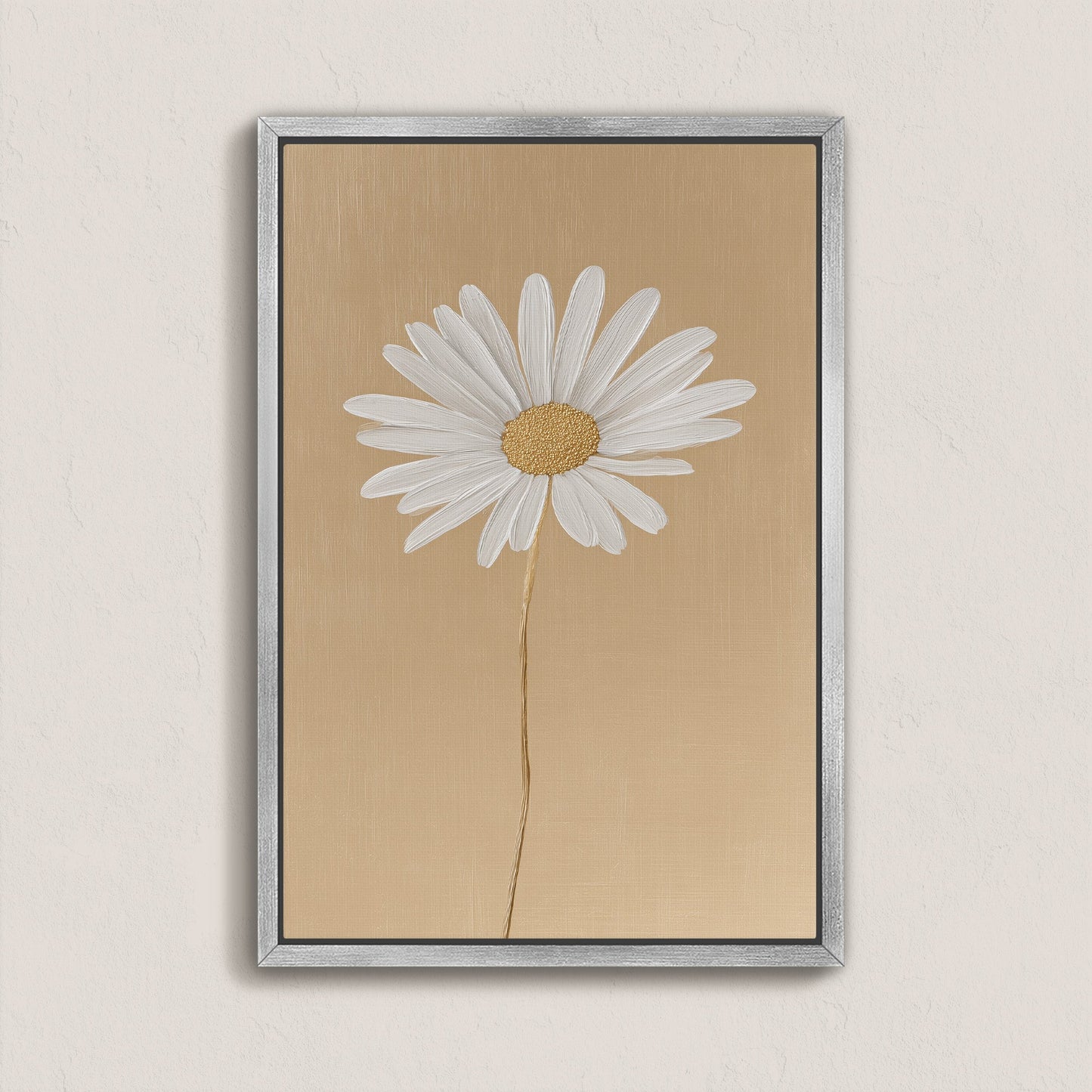 'Bloom' canvas print featuring a single white daisy on a golden-beige background with a silver frame, minimalist floral wall art