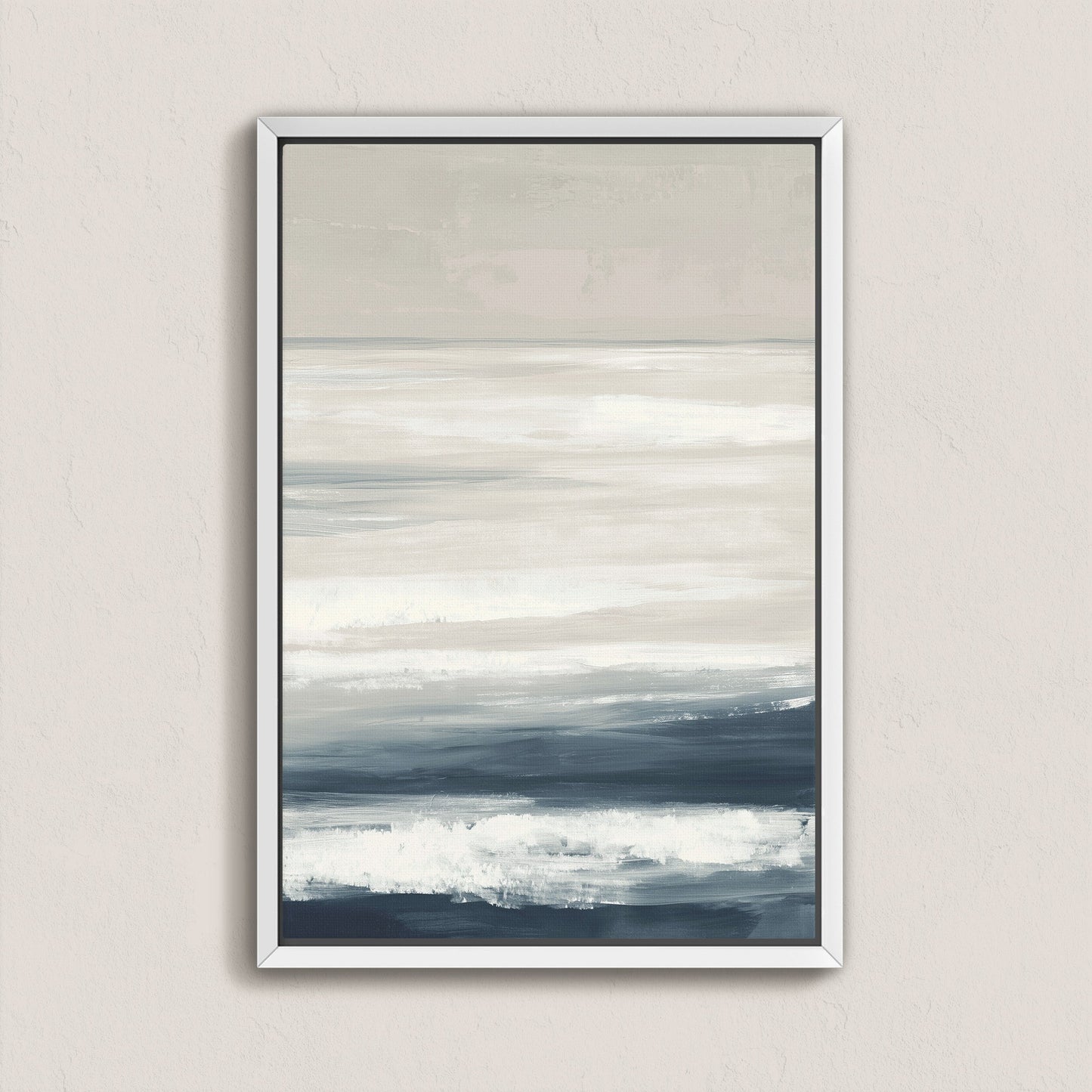 Syd Canvas Print featuring calming layers of ivory, sand, and indigo depicting a serene shoreline in a modern white frame.