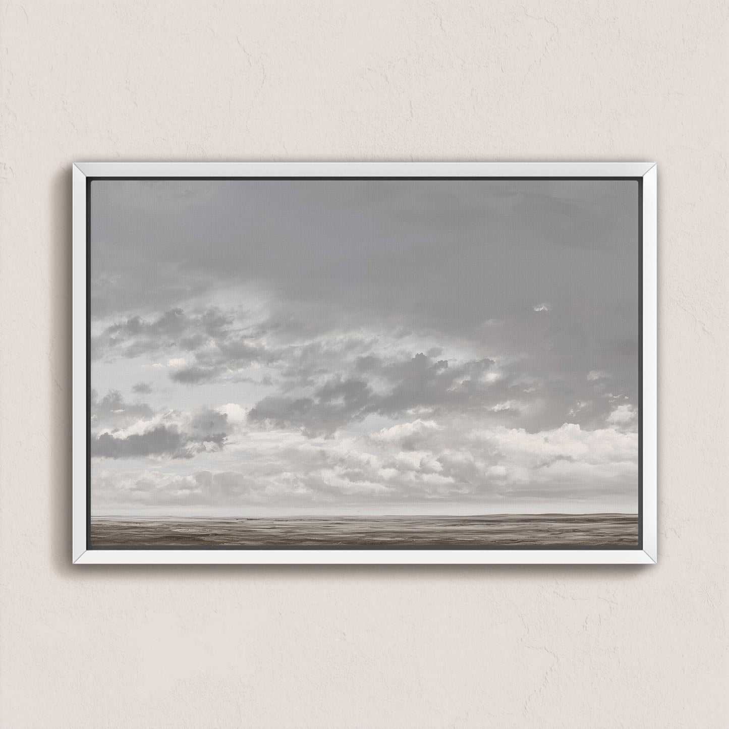 Duskfield canvas print featuring gray clouds over a tranquil plain with silvers and taupes, framed in white for modern coastal decor