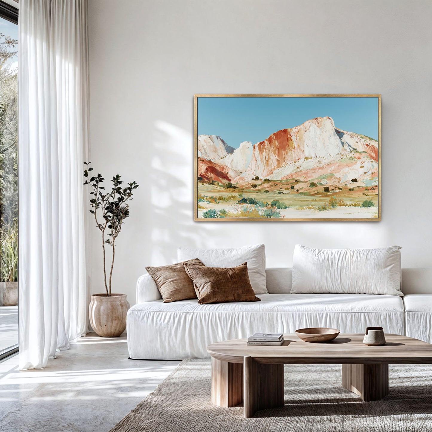 a serene living room with a large painting of a mountain landscape hanging on the wall. The room is decorated with a white sofa, a wooden coffee table, and a potted plant. The overall atmosphere of the room is calm and inviting, with the natural elements of the painting and the indoor plants contributing to the peaceful ambiance.