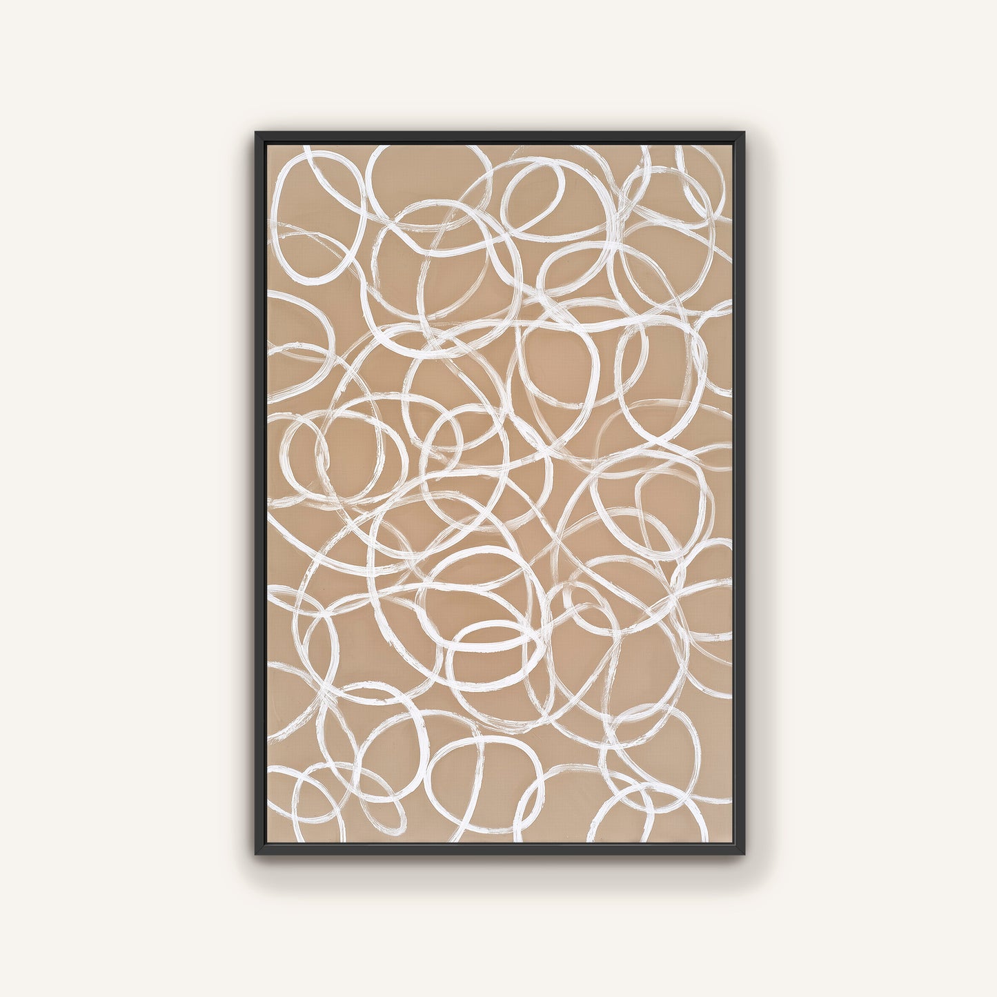 a framed abstract artwork with a repeating pattern of white circles on a beige background.