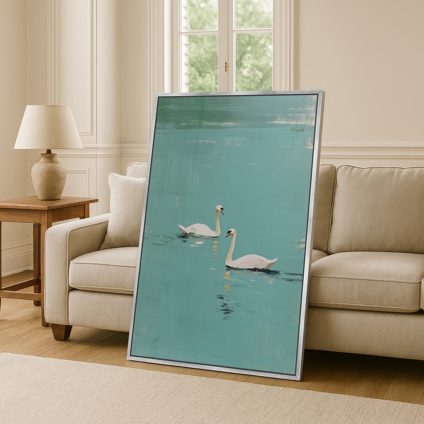 Black framed Evara swan lake art above console, bright modern living room design with neutral palette.