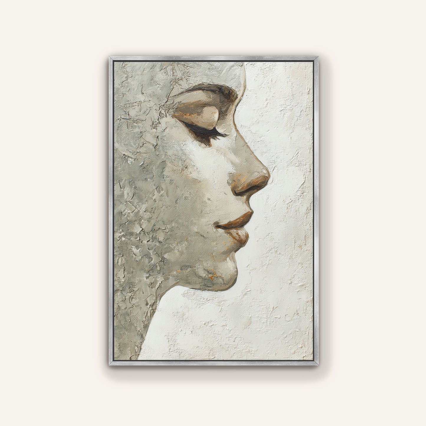 Neutral textured portrait wall art depicting a woman’s face in profile with a sleek silver frame.