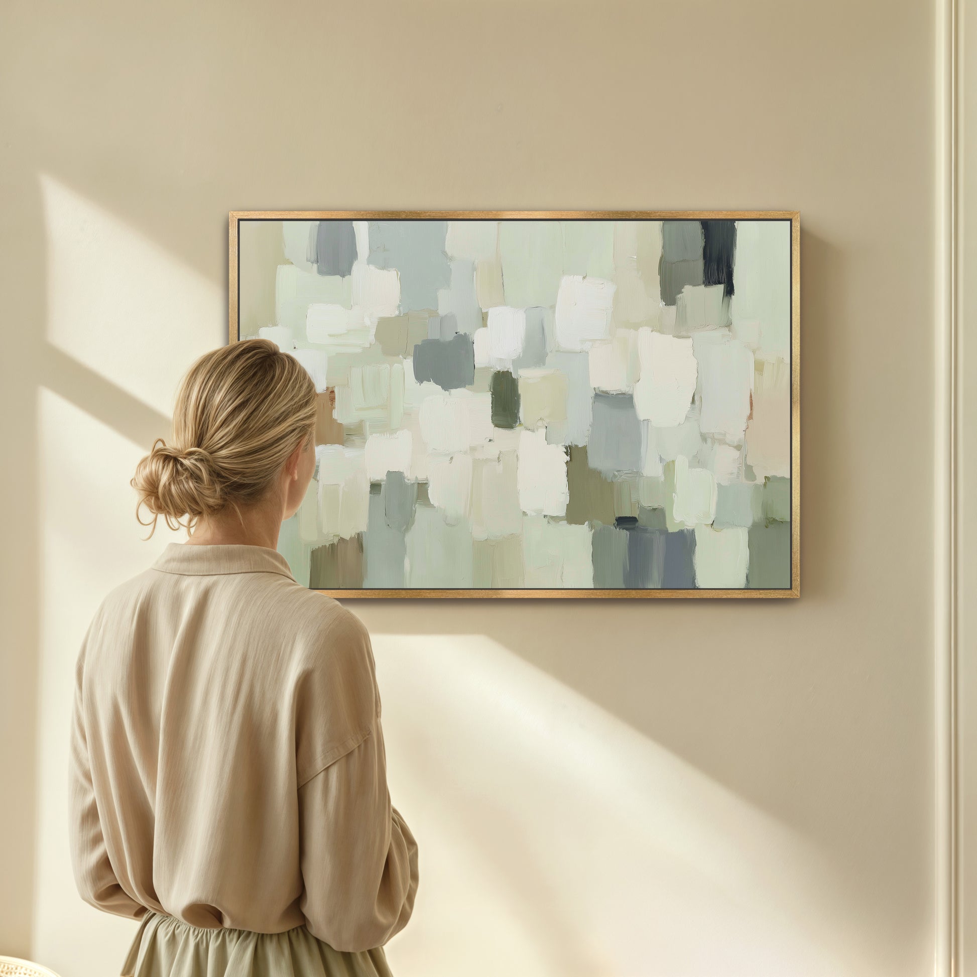 A woman stands in front of a large abstract painting, gazing at it with interest.