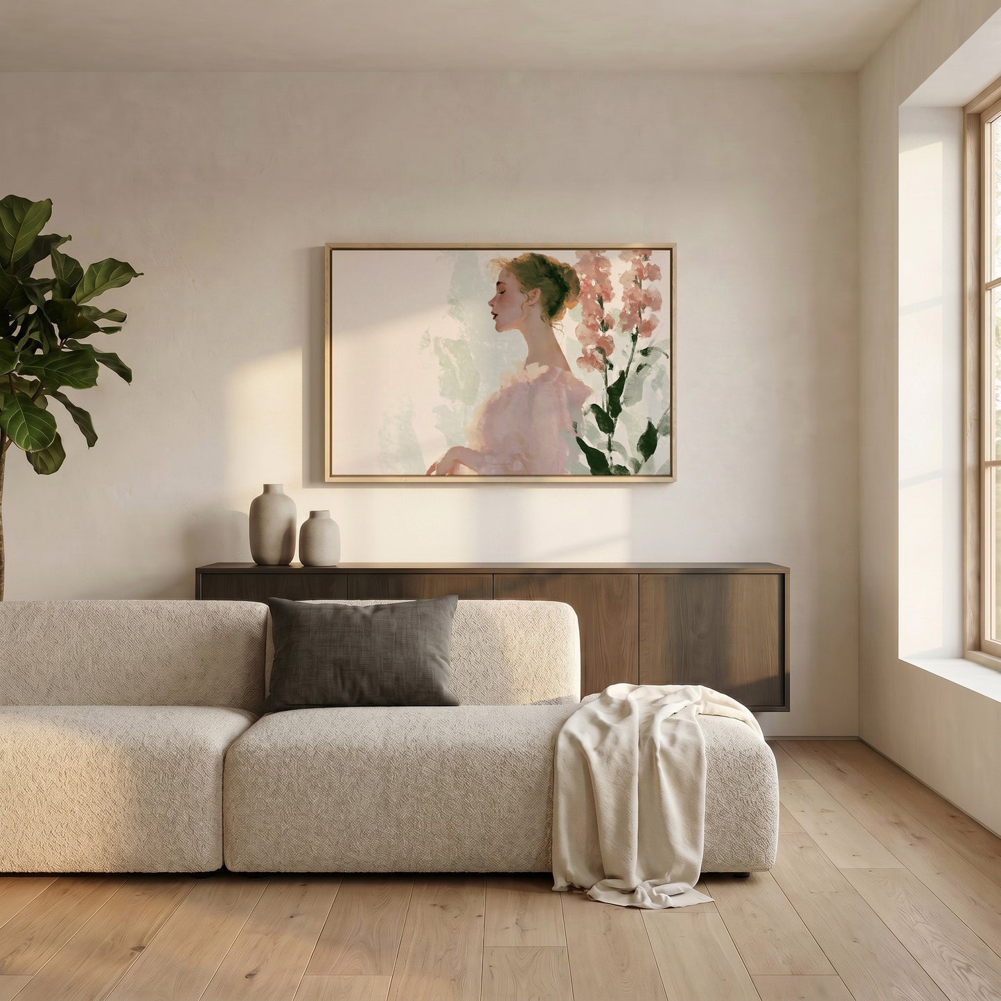 a serene living room with a large, framed painting of a woman's profile hanging on the wall above a beige sofa. The sofa is adorned with a gray throw pillow and a white blanket, creating a cozy and inviting atmosphere. The room is further enhanced by the presence of a potted plant and a wooden cabinet, adding to the overall aesthetic and comfort of the space.