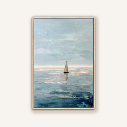 a sailboat on the water, with a cloudy sky in the background.