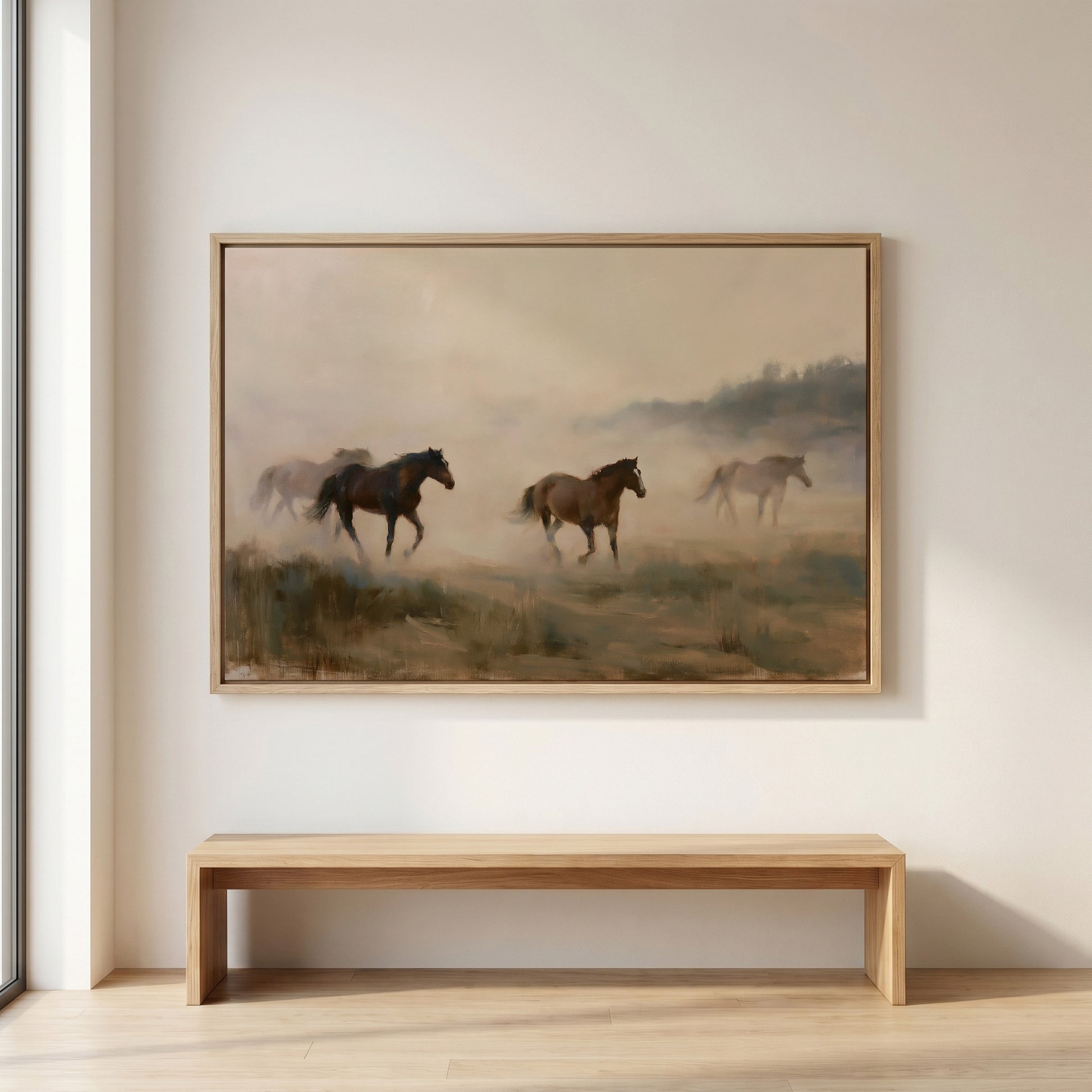 a large painting of three horses running across a grassy field.
