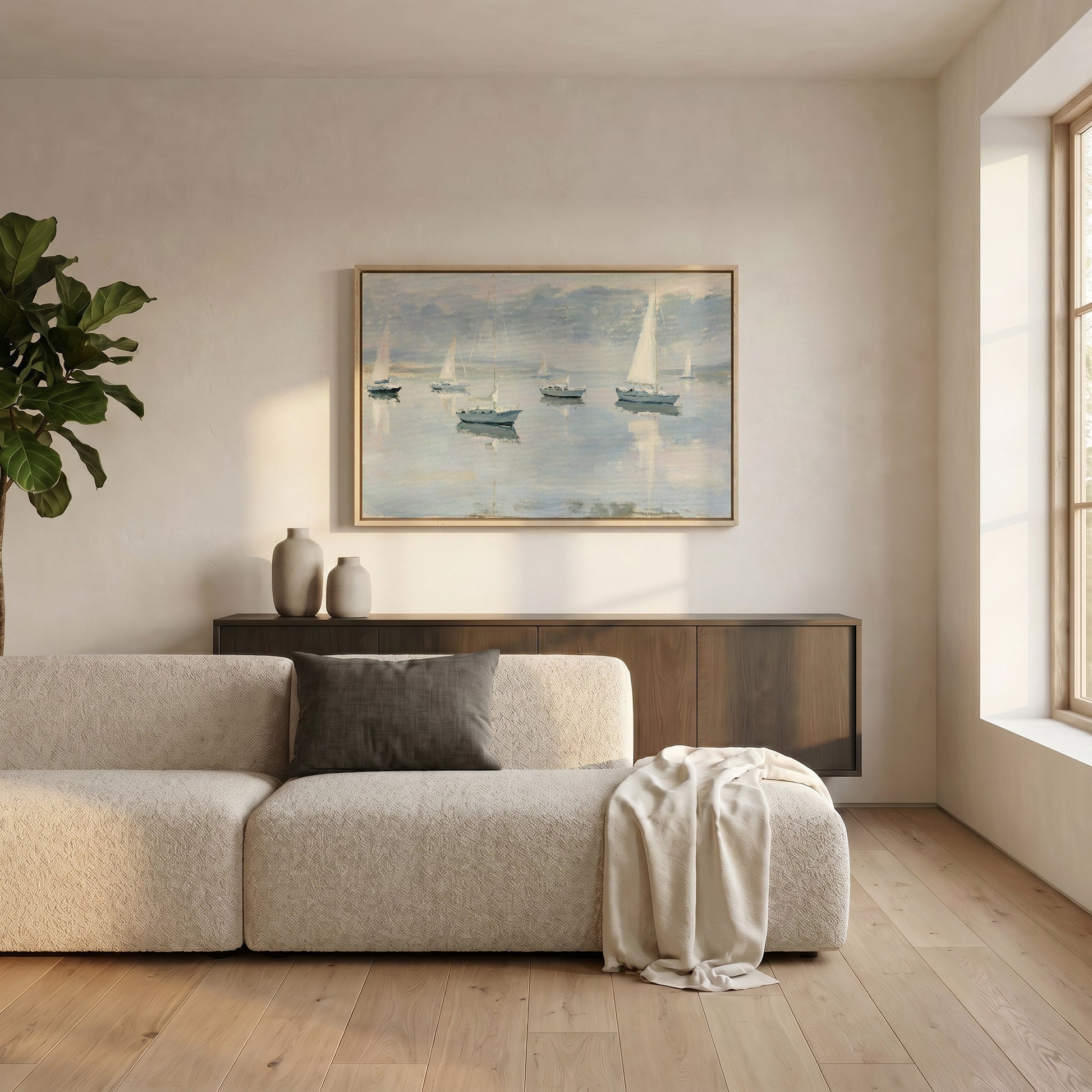 a serene living room with a large window, a white sofa, a wooden cabinet, and a framed painting of sailboats on the wall.