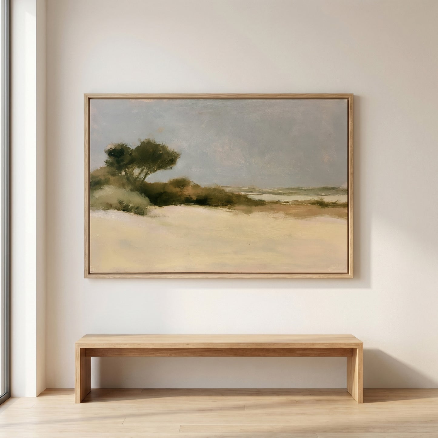 a large landscape painting hanging on a white wall above a wooden bench.