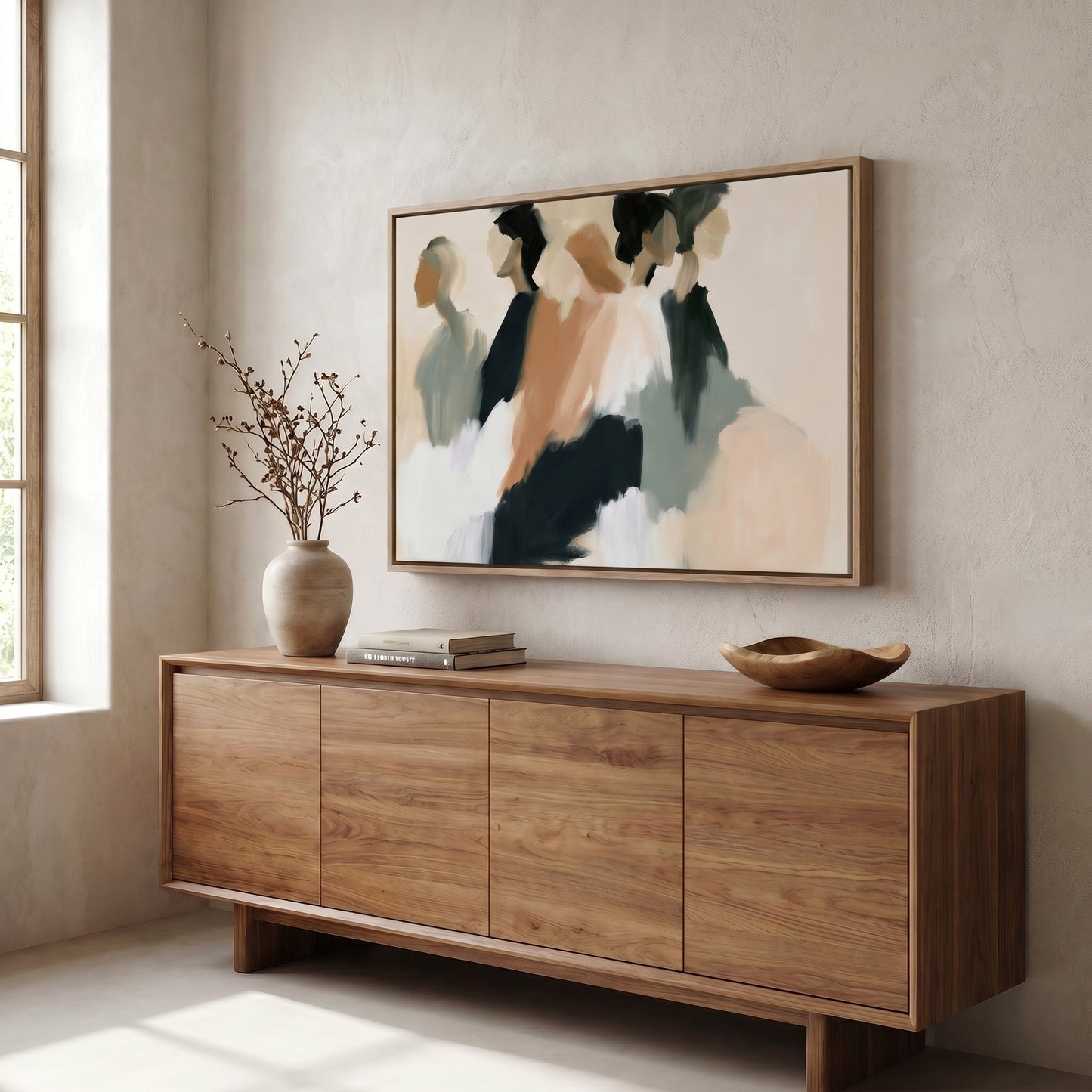 a wooden cabinet with a vase of branches and a framed abstract painting hanging above it.