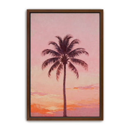 A framed painting depicting a tall palm tree against a sunset sky.