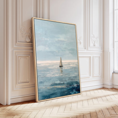 A large framed painting depicting a sailboat on the ocean, with a serene and peaceful atmosphere.