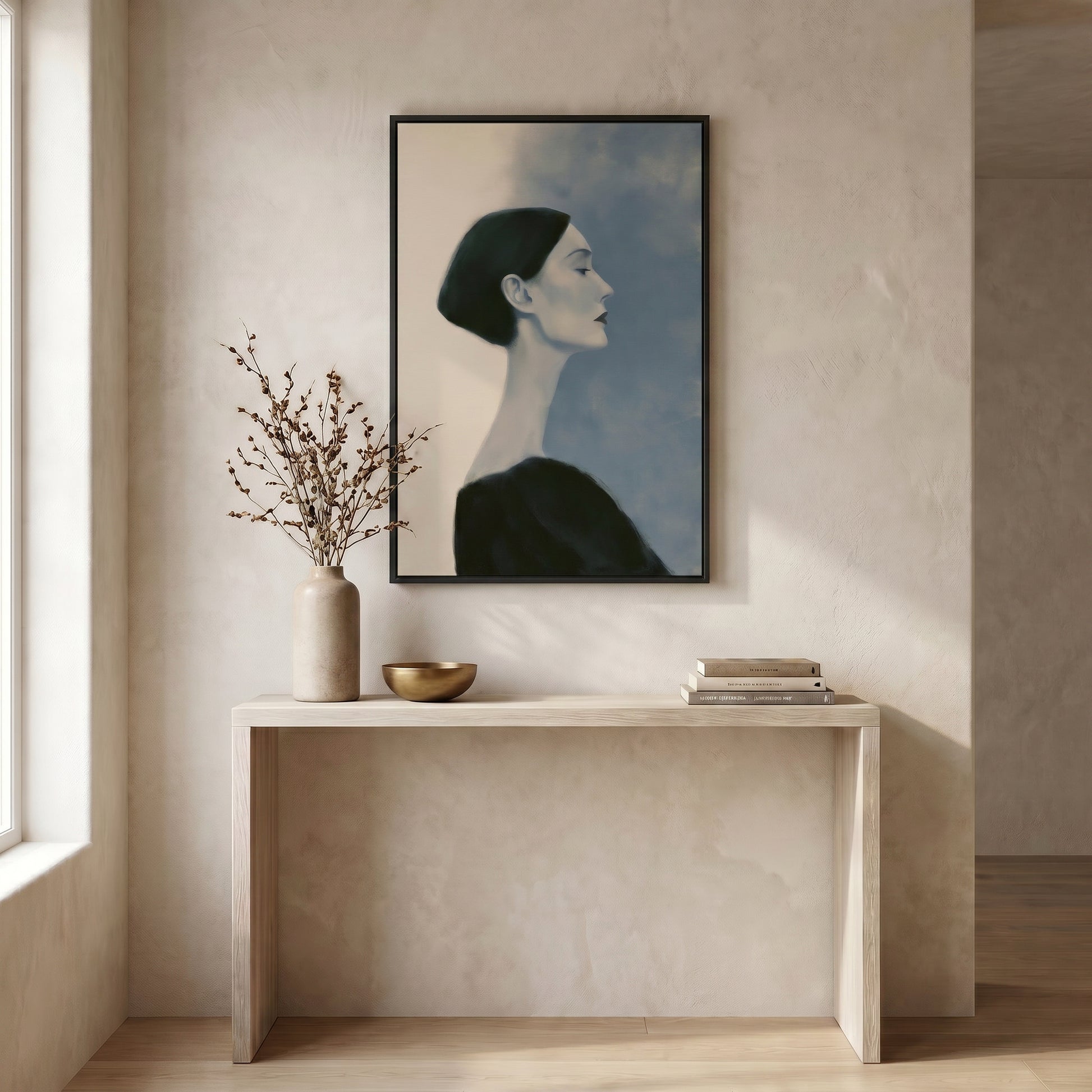 a minimalist interior design with a large portrait of a woman hanging on the wall above a white console table. The table has a vase of branches and a bowl on it, creating a serene and elegant atmosphere.