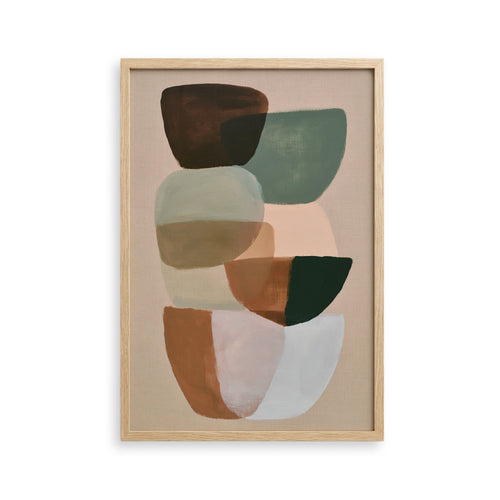 The image is a framed abstract art piece featuring a variety of shapes and colors, including shades of brown, green, and white.