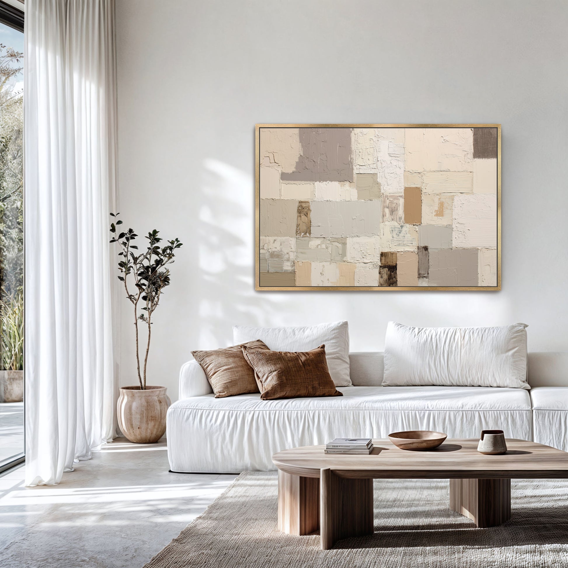 a modern living room with a white sofa, a wooden coffee table, and a large abstract painting on the wall.