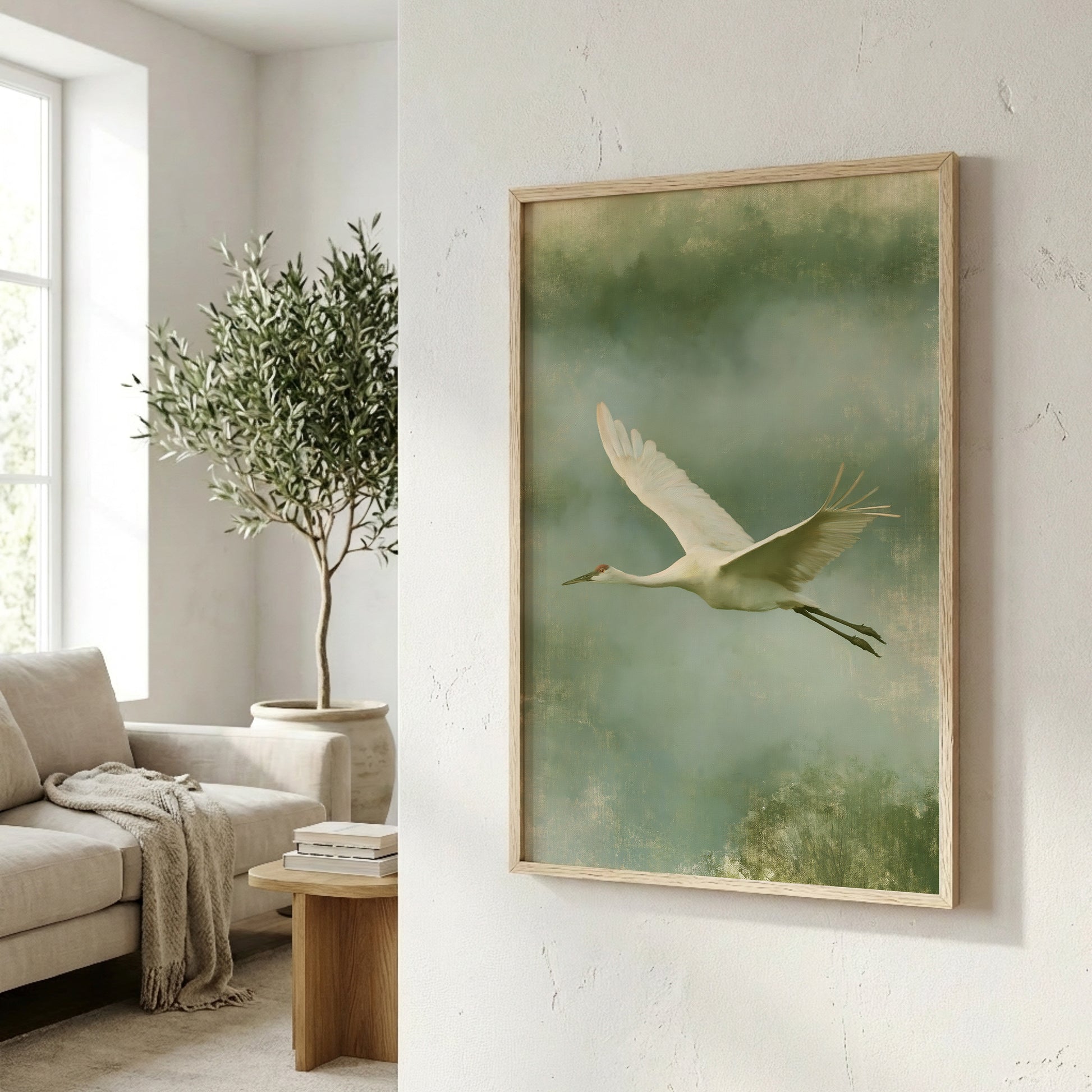 a serene indoor setting with a large white crane in flight, a potted plant, a wooden table, and a beige sofa.