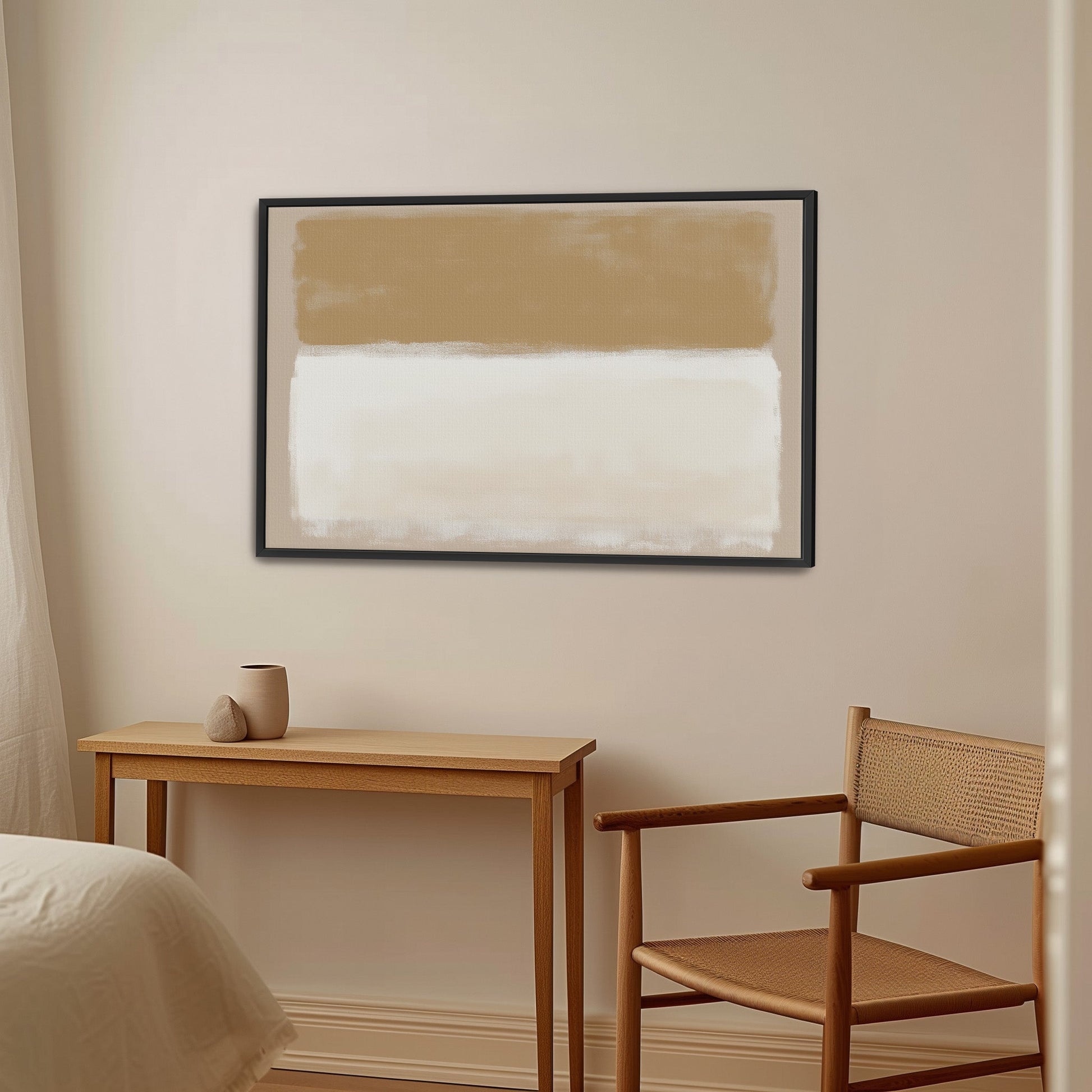 Sienna canvas print with warm golden and ivory abstract tones in black frame hanging in minimalist beige room with wooden furniture