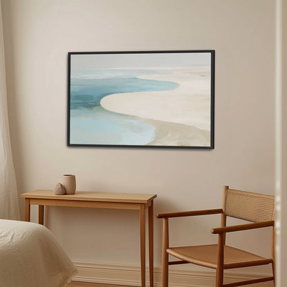Tideway Canvas Wall Art depicting serene sea and sand in soft blue and beige tones with black frame in minimalist room setting