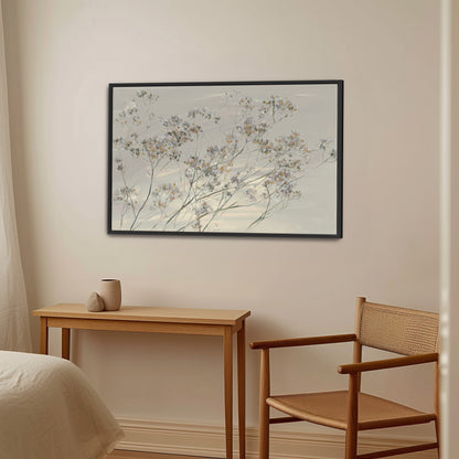Breeze Wall Art canvas with soft wildflowers in muted tones, framed in black, hanging in a modern serene bedroom setting