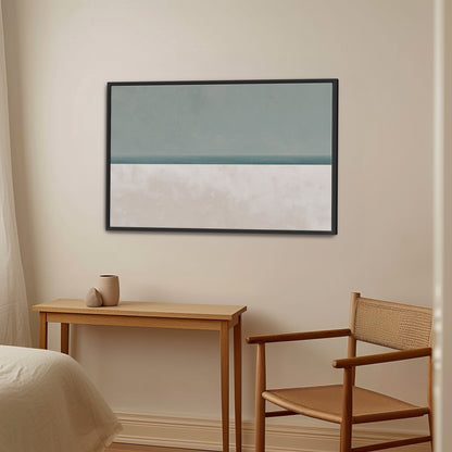 Minimalist Azure canvas print featuring serene sea and sky in muted sage and sand hues, framed in black and displayed in a modern room.