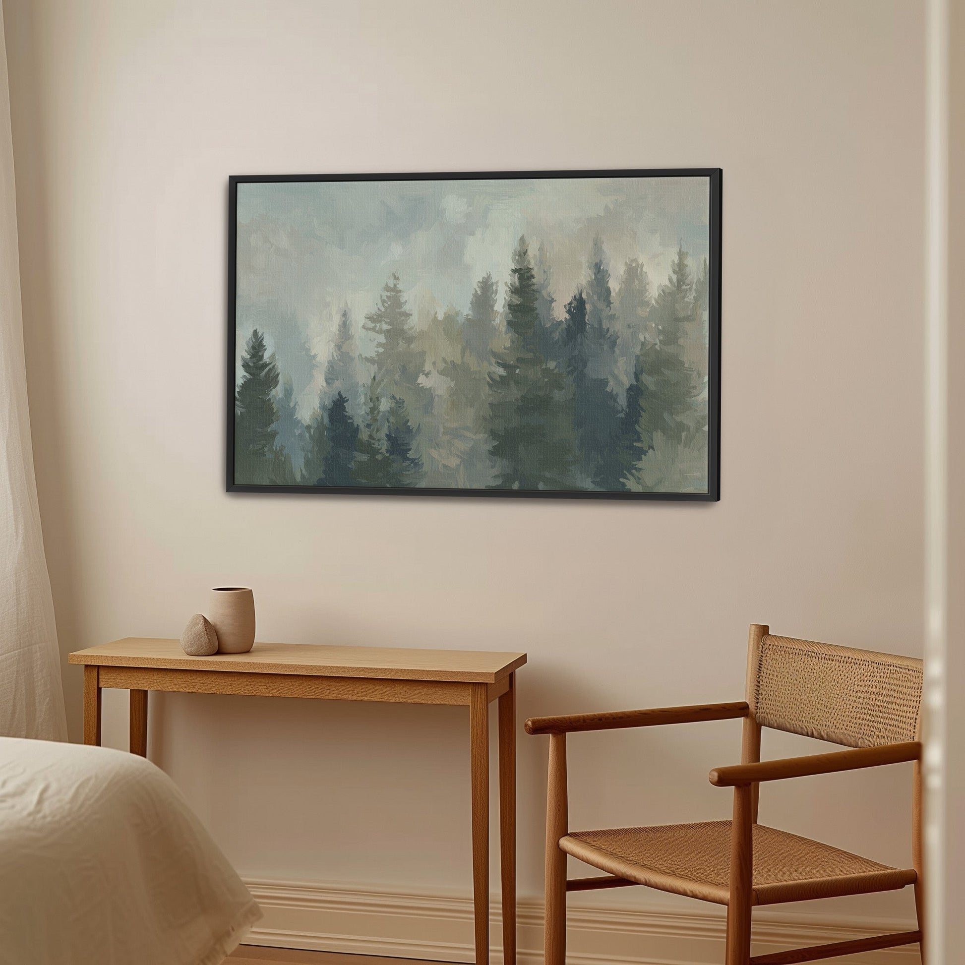 Ever Canvas Wall Art depicting misty forest with pine trees in soft sage and blue tones, framed and hung in a modern, minimalist room.