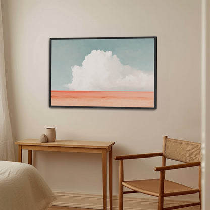 Aurea Canvas Wall Art featuring a white cloud over coral horizon in a black frame in minimalist room