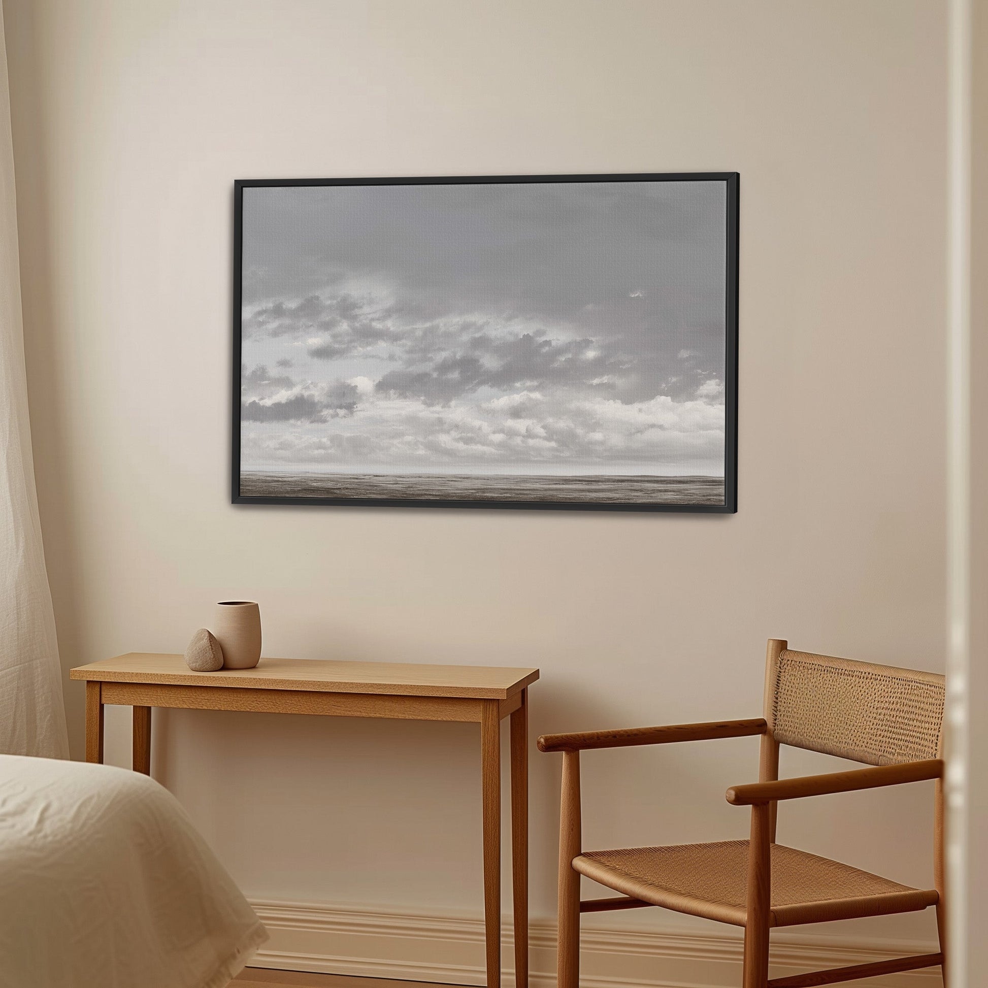 Duskfield Canvas Print framed in black with gray cloudscape above tranquil plain in minimalist room setting