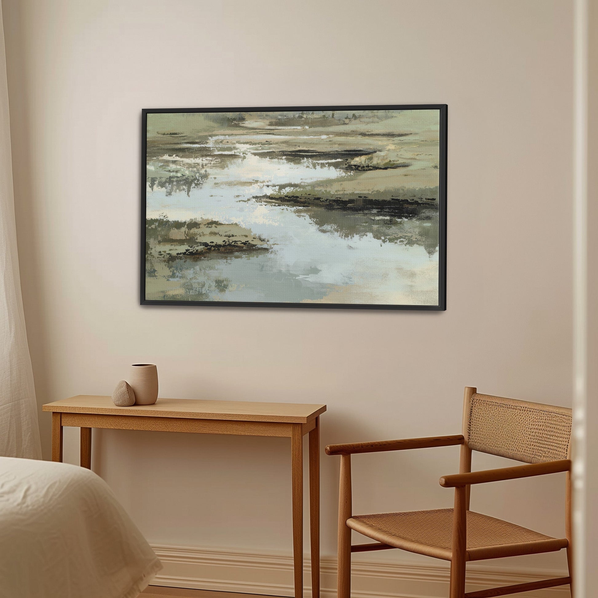 Reed Canvas Print abstract art in sage, sand, and ivory tones framed in black, displayed in a serene modern interior.