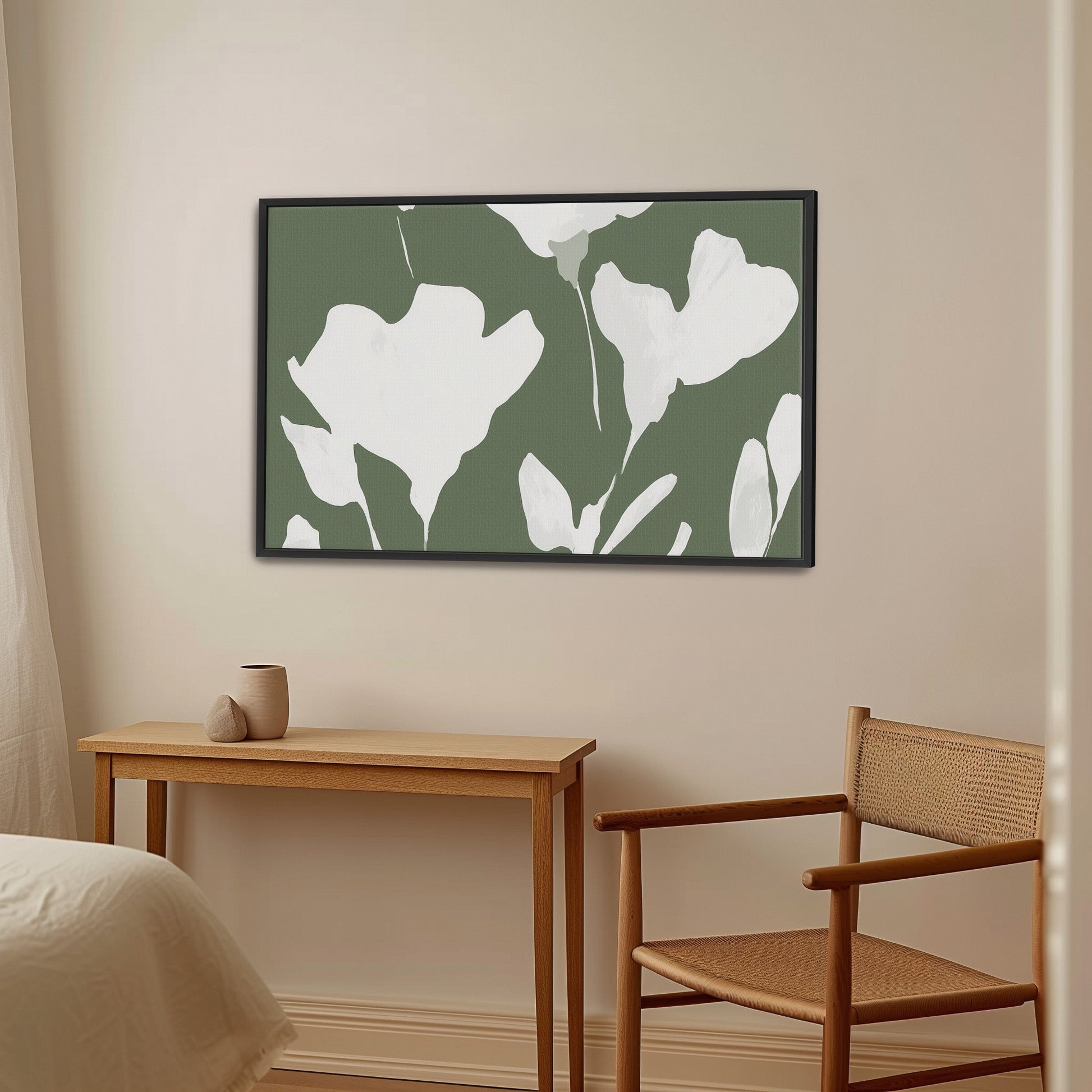 Verdal Canvas Print featuring ivory floral silhouettes on muted olive background in a modern black frame, displayed in a minimalist neutral room.