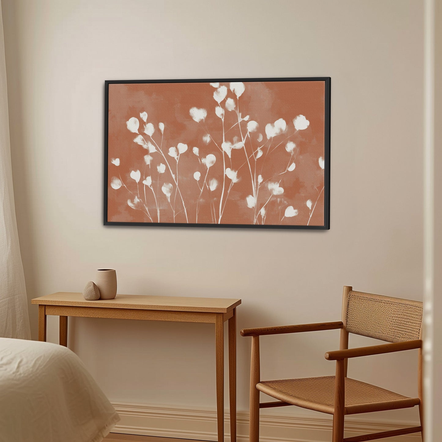 Ember Cavas Print framed floral artwork with white petals on terracotta background in modern room setting