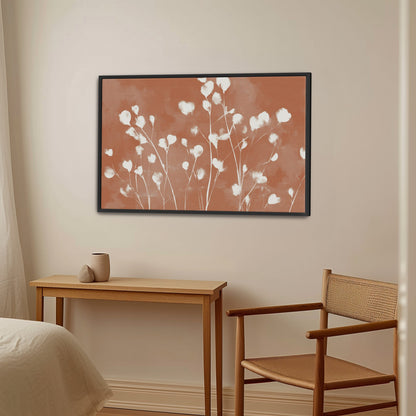 Ember Cavas Print framed floral artwork with white petals on terracotta background in modern room setting