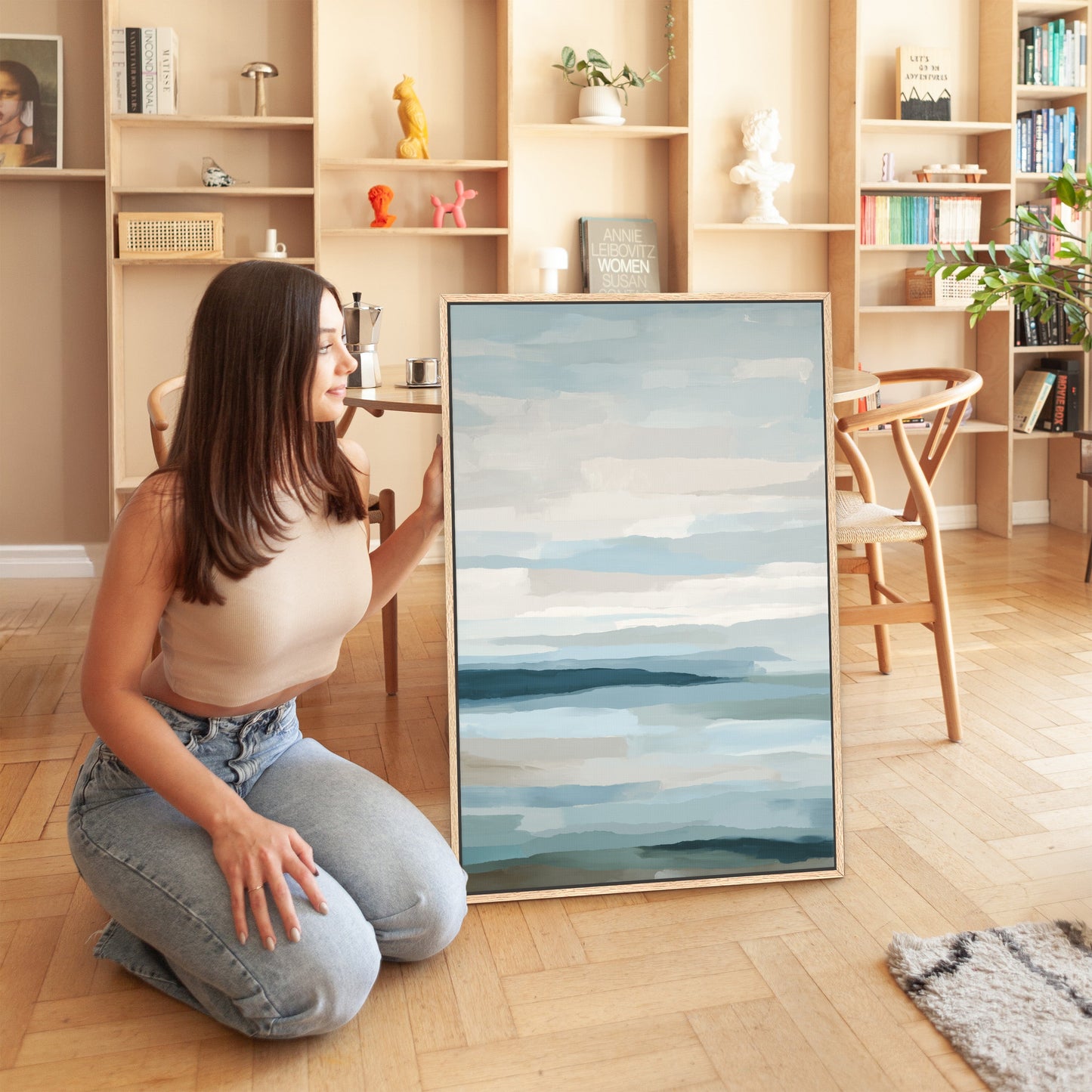 Lapse canvas print with soft blue, ivory, and sand tones depicting serene sea and sky in a modern living space