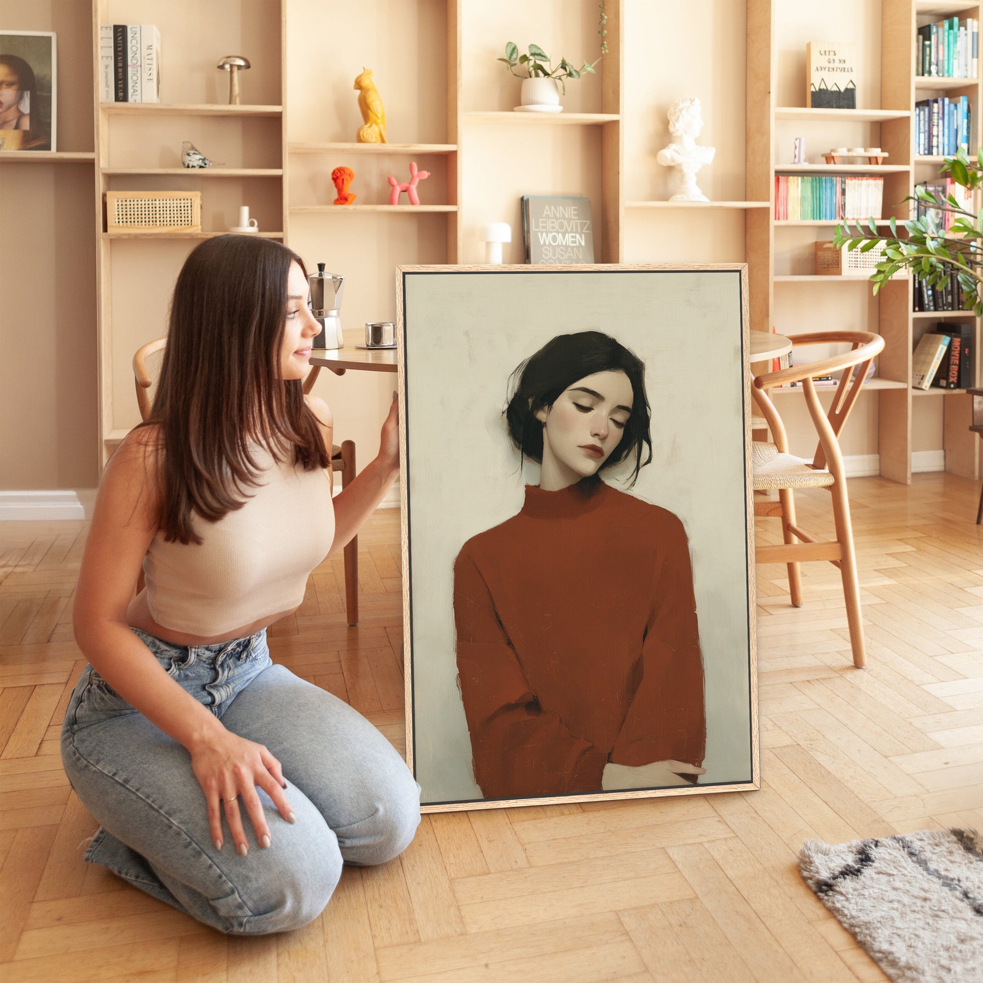 Modern Madi canvas wall art featuring serene woman in deep red sweater in minimalist living space