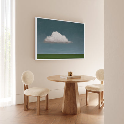 Eave canvas print of a single cloud above a green horizon in a minimalist modern room with round chairs and wooden table