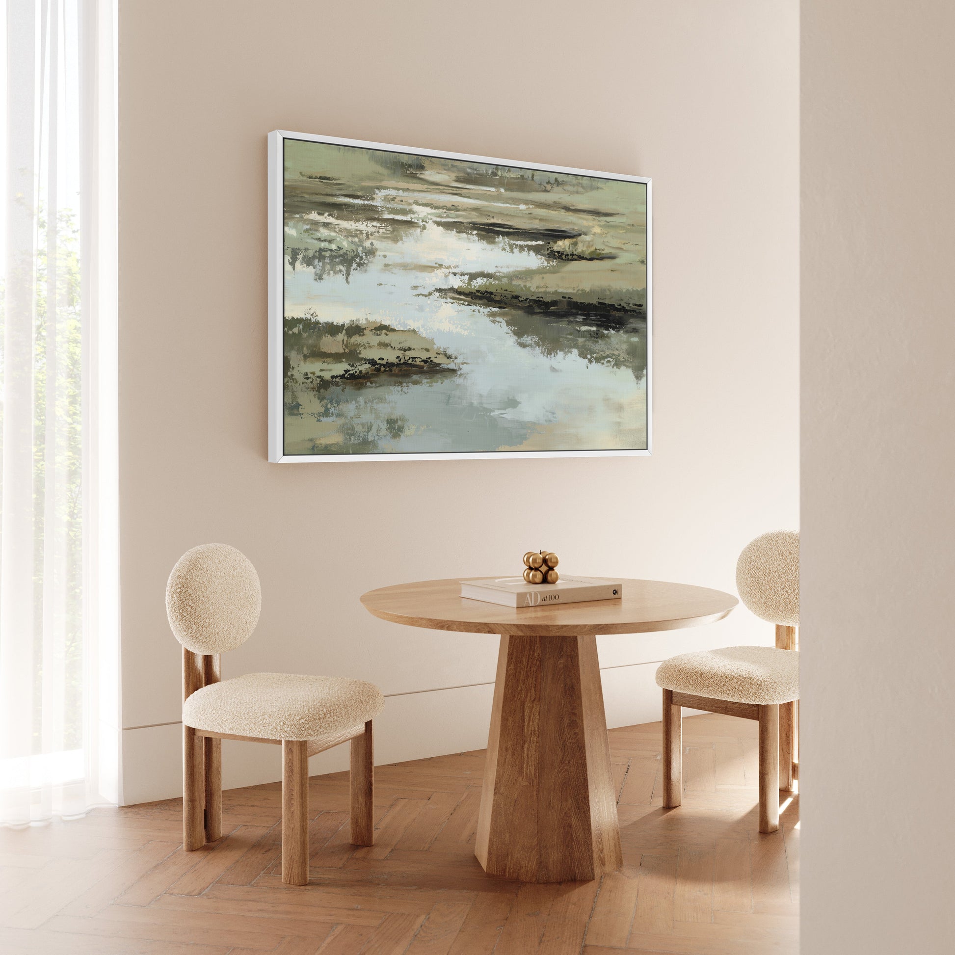 Reed canvas print with layered sage, sand, and ivory tones depicting calm water and earth, displayed in a modern neutral dining room