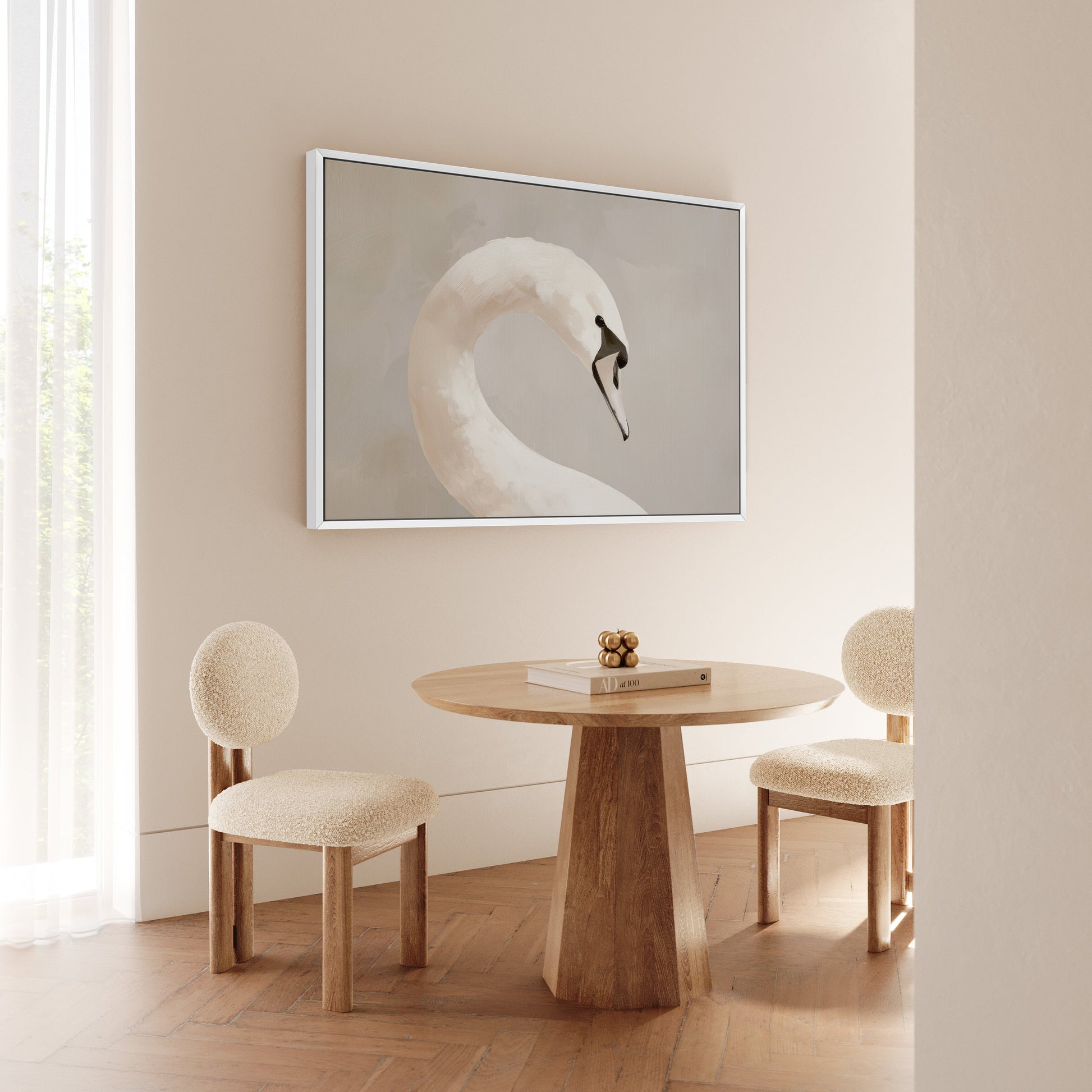 Minimalist room with Lumine Canvas Print of a lone swan in soft light above a wooden table and beige chairs