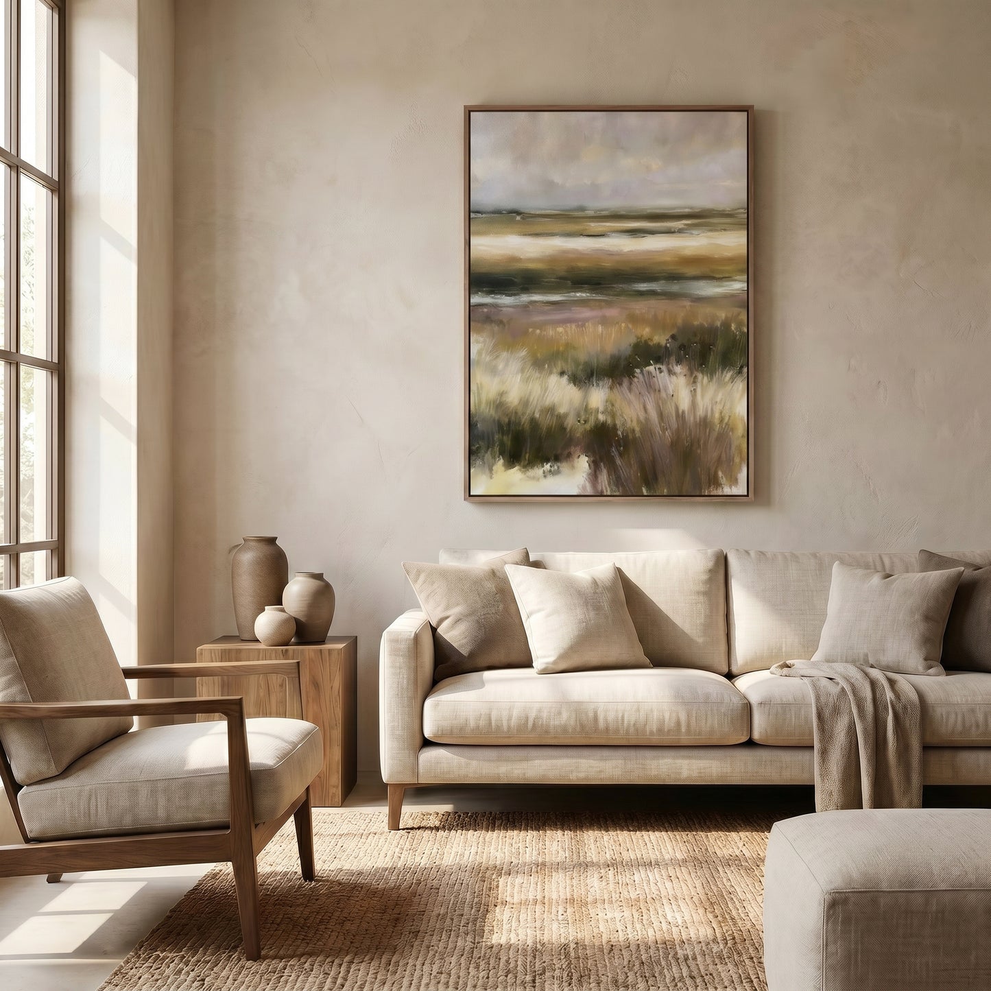 a serene living room with a large landscape painting hanging on the wall, a beige sofa, a wooden side table, and a large window that allows natural light to fill the space.