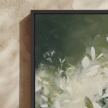 Verdure Canvas Wall Art featuring soft ivory leaves and deep green tones in a modern botanical abstract design with a black frame