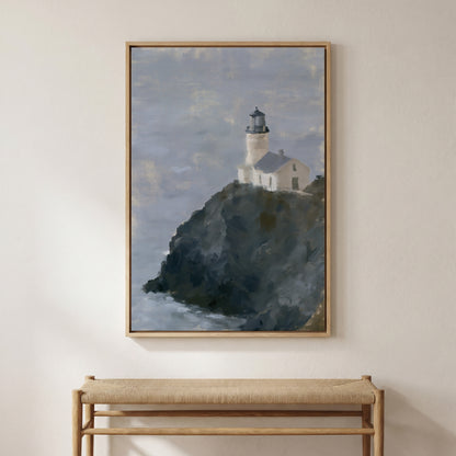 a framed painting of a lighthouse on a cliff, hanging on a wall above a bench.