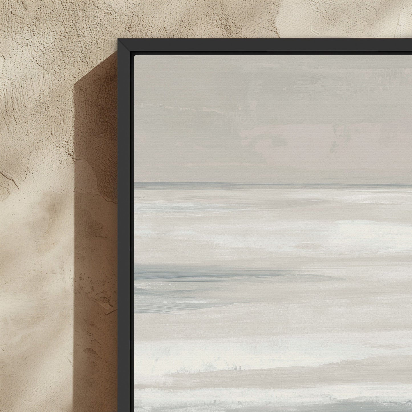Framed Syd canvas print featuring soft ivory, sand, and indigo coastal abstract art in a black solid wood frame