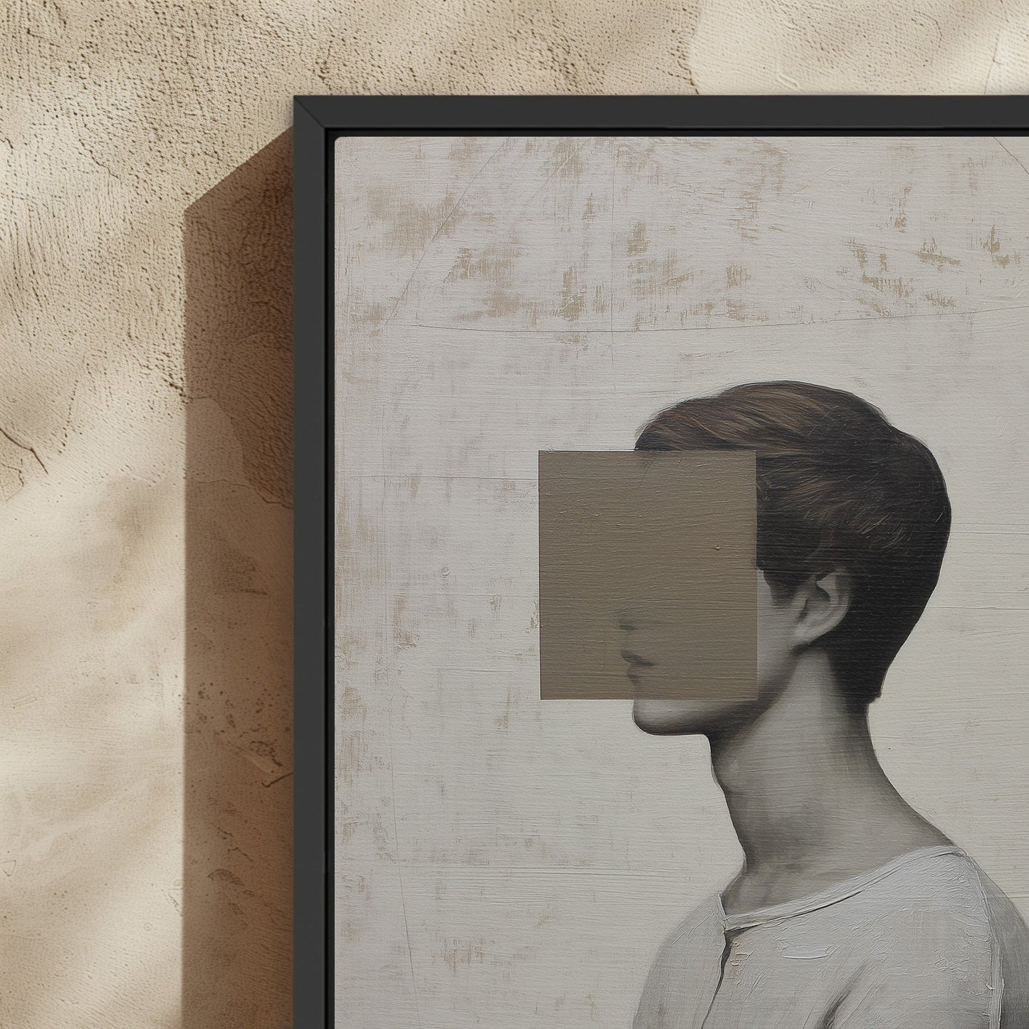 Masked canvas print featuring a minimalist portrait with a geometric mask and muted color palette in a black frame