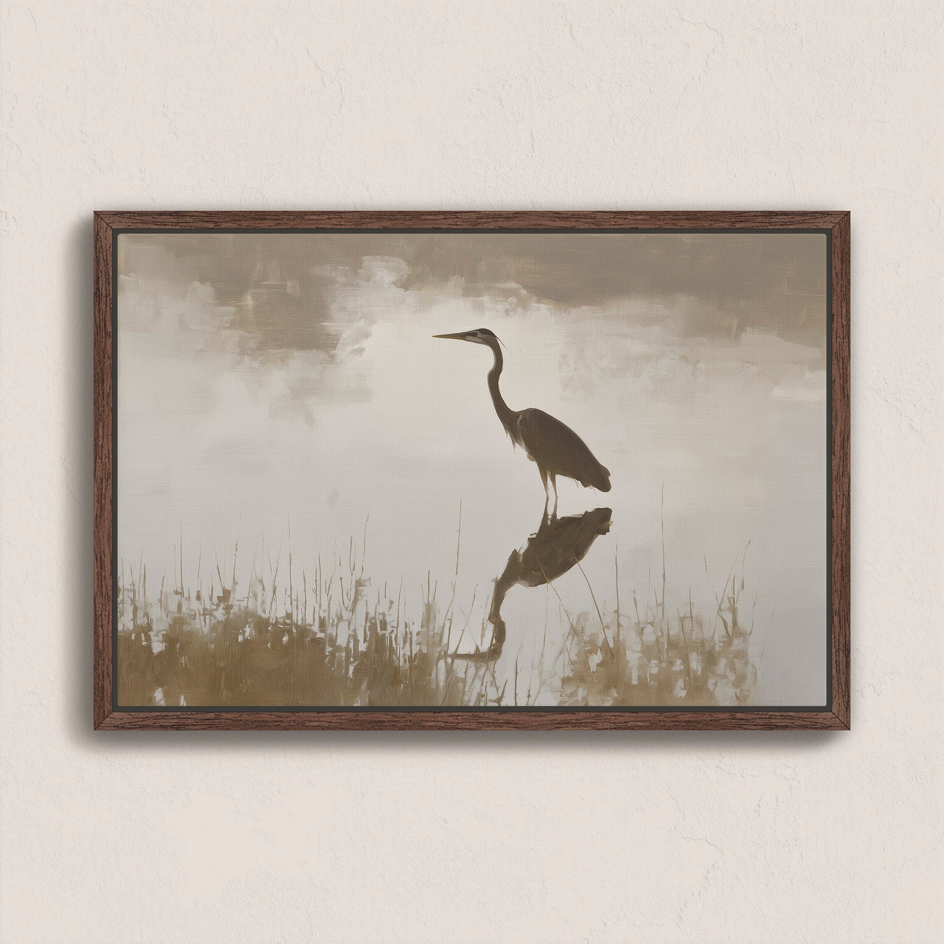 Wade Canvas Print of heron reflecting in water with soft light and muted earth tones in wooden frame