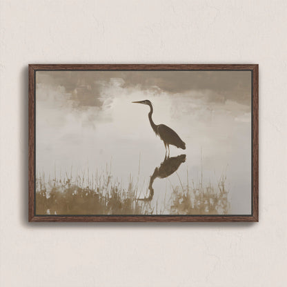 Wade Canvas Print of heron reflecting in water with soft light and muted earth tones in wooden frame