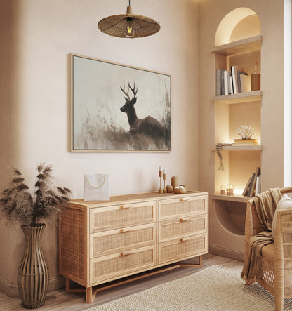 Haven Canvas Print of a deer resting in soft grasses with warm neutral tones hanging in a cozy modern nature-inspired room