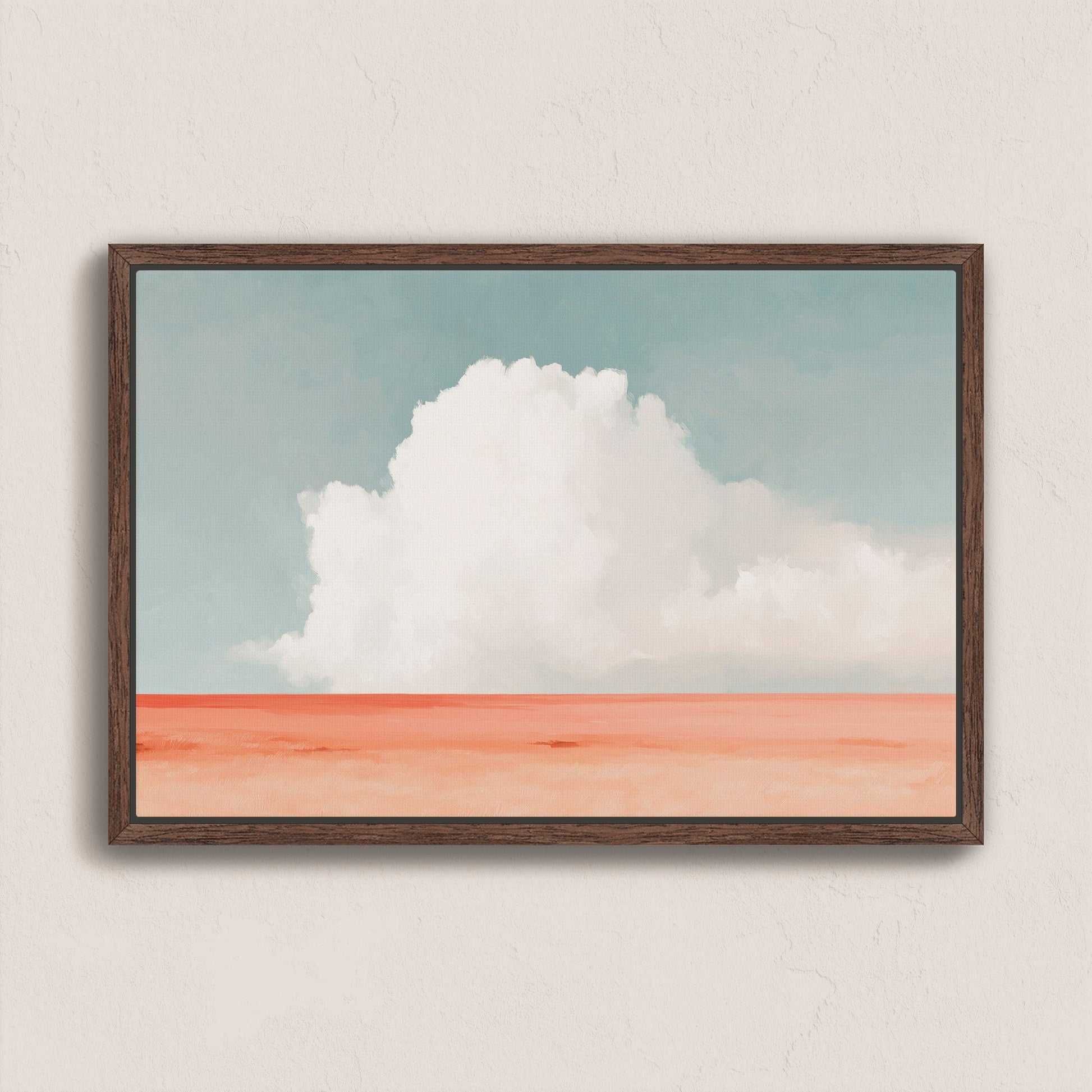 Aurea Canvas Wall Art featuring a white cloud over a coral desert and soft blue sky in a wooden frame