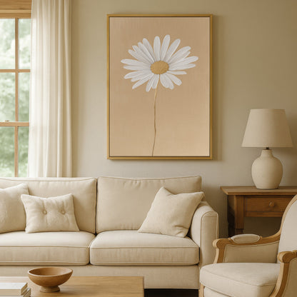 'Bloom' canvas print featuring a single white daisy on golden-beige background in a cozy living room setting