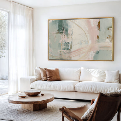 a modern living room with a large abstract painting on the wall, a white sofa, a wooden coffee table, and a brown leather armchair.