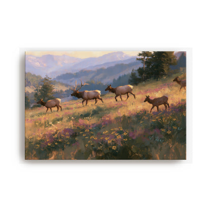 A group of elk walking through a grassy field with mountains in the background.