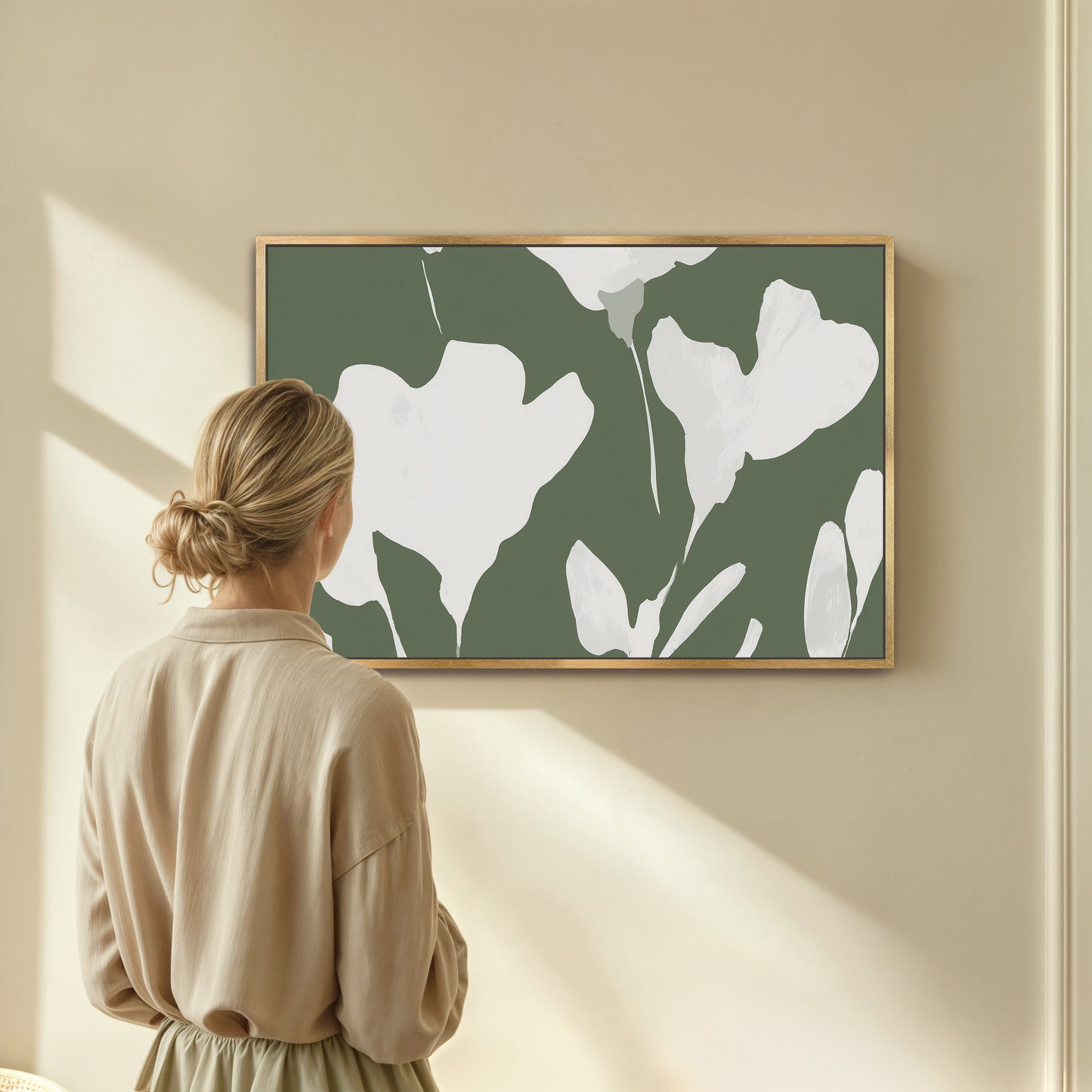 Verdal Canvas Print with ivory floral silhouettes on muted olive background in wooden frame hung in modern neutral room